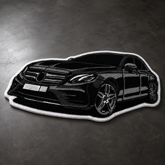 Black hand-tufted car rug shaped like a German executive saloon, in a living room