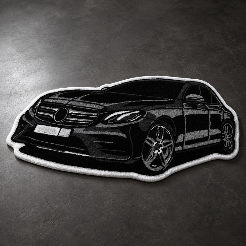 Black hand-tufted car rug shaped like a German executive saloon, in a living room
